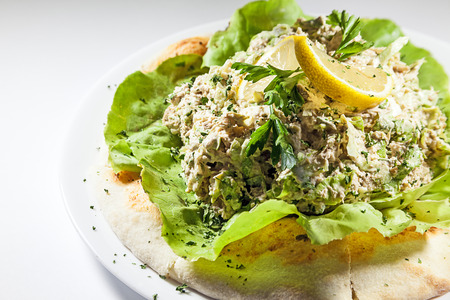 Lettuce with fish cream on bun. Vegetarian meal.の写真素材