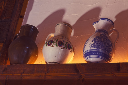 Prague, Czech - October 20, 2014: Serbian restaurant  with name Biogurmania - Jelica, in heart of Prague, traditional interior design, three handmade jars as decoration.のeditorial素材