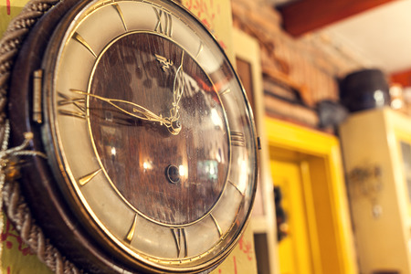 Cacak, Serbia - December 06, 2014: Old retro clock on the wall, as decorative detail inside Serbian restaurant.のeditorial素材