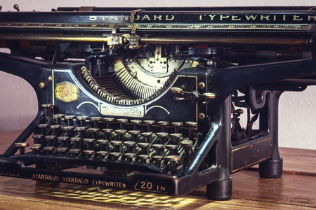 Retro design of an old typewriter, dusty surfaces in good shape.