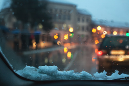 Waiting on semaphore, car interior details, winter season, city environment.の写真素材