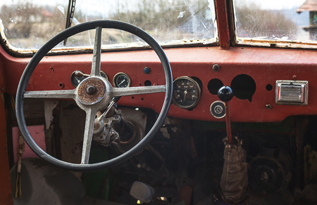 Old bus interior, view on steering wheel and control table.の写真素材