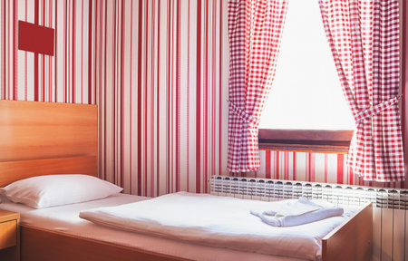 Hotel room interior, calm and peaceful atmosphere in red and white.の写真素材