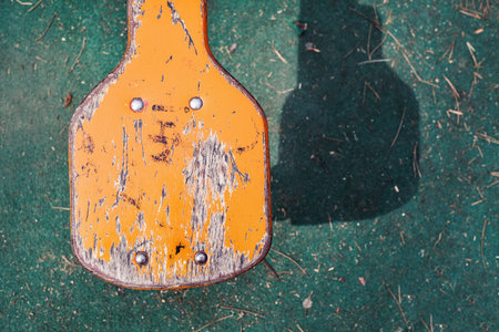 Details of a teeter seat, weathered wooden texture.の写真素材