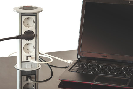 Details of an electric plug built in table.