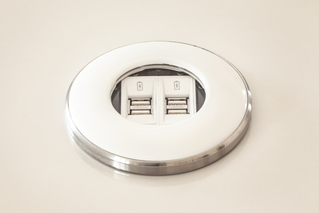 Modern usb dock built in table, made of plastic and metal ring as decoration.の写真素材