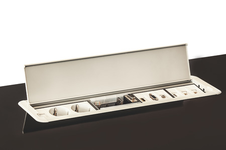 Modern electric plugs built in table, clever solutions for saving space, and making cords invisible.の写真素材