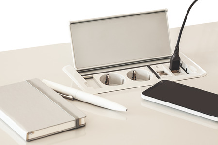 Modern electric plugs built in table, clever solutions for saving space, and making cords invisible.の写真素材