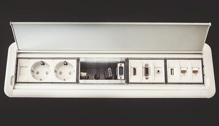 Modern electric plugs built in table clever solutions for saving space and making cords invisible.の写真素材