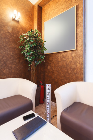 Modern power supply between armchairs, connections for usb and electric power.の写真素材
