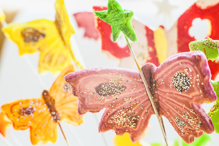 Details of sugar butterfly, as part of birthday cake decoration.の写真素材
