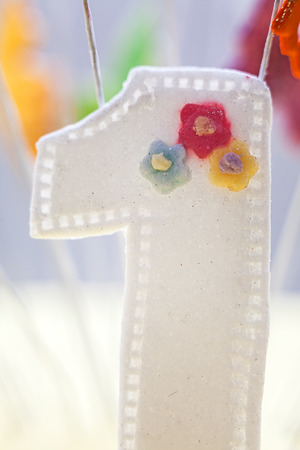 Number one made of sugar as part of birthday cake decoration.の写真素材