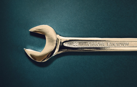 Just one wrench of steel, looks like it is of gold.の写真素材