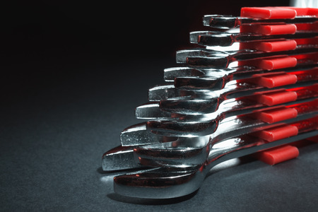 Set of wrenches on right side of an image, empty left side with blurry gradient background.の写真素材