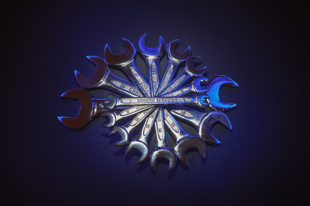 Interesting composition made of wrenches, accentuated center part with title in the middle.の写真素材