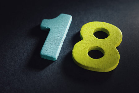 Number eighteen in up right corner, symbolizes adult age of life.の写真素材