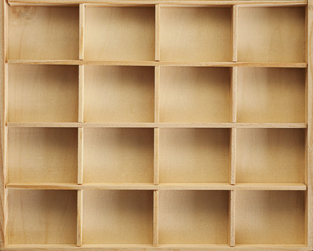 Details and textures of a wooden container, sixteen square partitions.