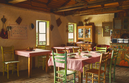 Interior design of an old Serbian restaurant, decoration and prepared table for lunch.の写真素材