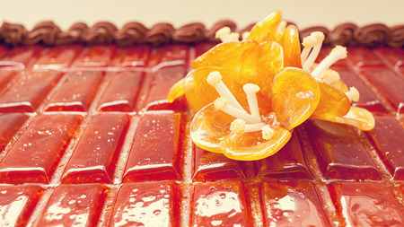 Details of an orange flower, made of sugar as decoration on birthday cake.の写真素材