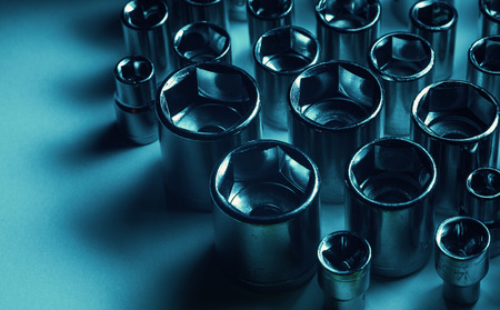 Modern wrench with variable heads, in blue illumination.の写真素材