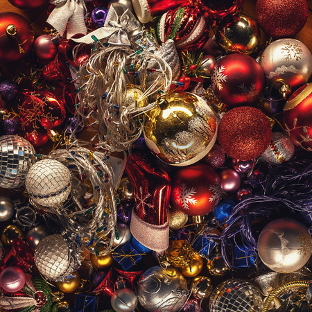 Old Christmas tree ornaments, colorful decoration prepared to be used, on parquet.の写真素材