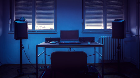Modern and simple music equipment under blue light, in empty old retro style room.の写真素材