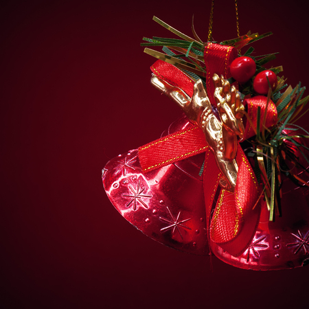 Details of Christmas tree decorated ornaments, partially illuminated.の写真素材