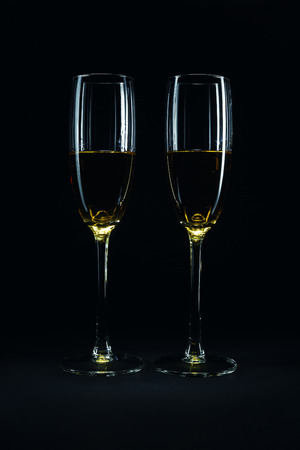 Luxury glasses with wine, studio isolated on black background.の写真素材