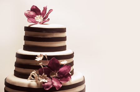 Details of a wedding or a birthday cake, triple size, in studio on white background.の写真素材