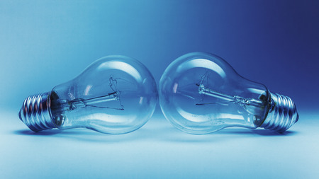 Not so clean unused two electric bulbs, blue illumination.の写真素材