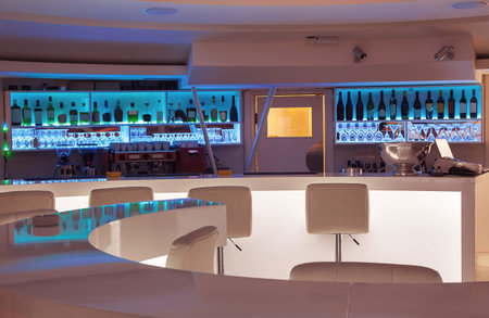 Interior of a modern cafe bar, white futuristic furniture with interesting lighting.の写真素材