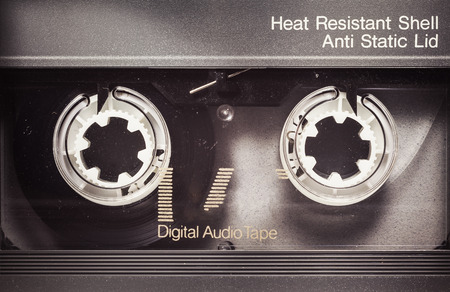 Details of an old dusty digital audio tape, retro technology from the 90's.の写真素材