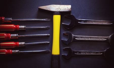 Set of wrenches, screwdrivers and one yellow hummer.の写真素材