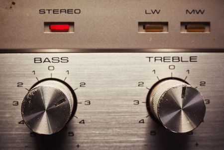 Details of an old radio receiver, close up view on bass and treble pots.の写真素材