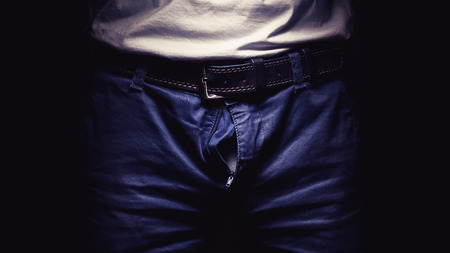 Details of a man's pants, open zipper.の写真素材