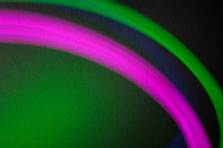 Lighting effects of colorful lights in front of wall.
