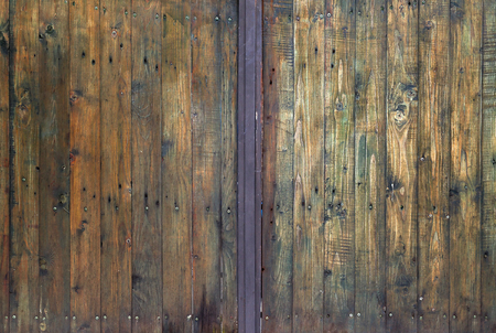 Closeup view on texture of a wooden door. の写真素材