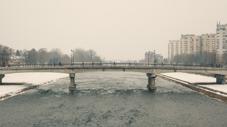 Two bridges with lot of walkers and no cars, winter season, bad weather. の写真素材