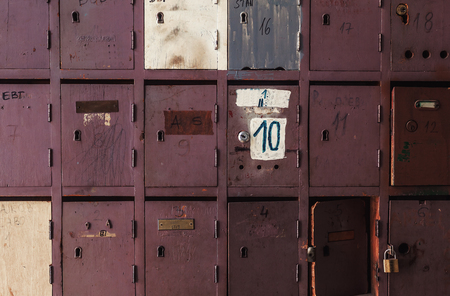 Retro look of an old wooden postal boxes, damaged but still in use.の写真素材
