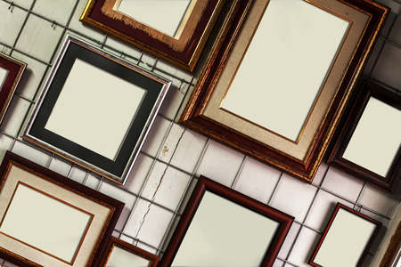 Details of various empty frames with white canvas, interior of a shop.の写真素材