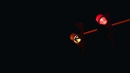 Part of semaphore, view on red and yellow lights and signs. の写真素材
