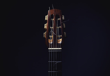 Gypsy acoustic guitar neck on dark background.の写真素材