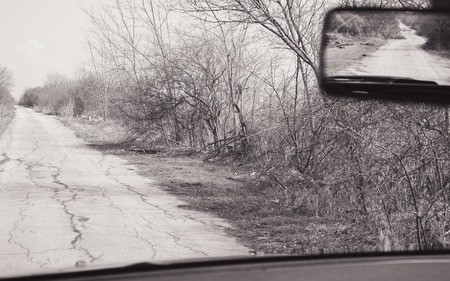 On unknown road, scene from car in black and white.の写真素材