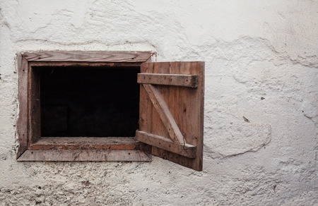 Stable wall and holes with wooden frames.の写真素材