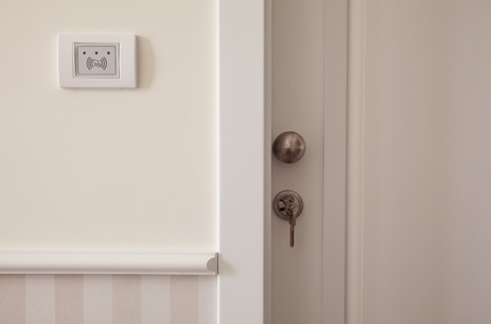 One part of a modern white doors and electronic device for reading card.の写真素材