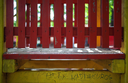 Closeup of red wooden fence, playground details.の写真素材
