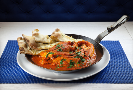 Shrimps in pepper and tomato soft with bread.の写真素材