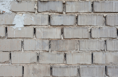 Texture details of a wall of gray concrete bricks.の写真素材
