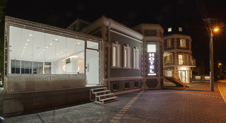 Exterior of a modern and new luxury hotel, night scene.の写真素材