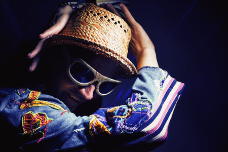 Dancing middle aged man in colorful funky clothes.の写真素材